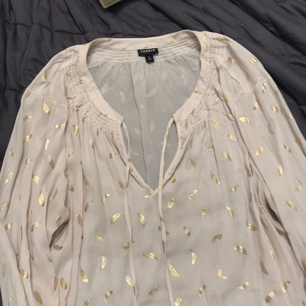 Torrid blouse with gold feathers.